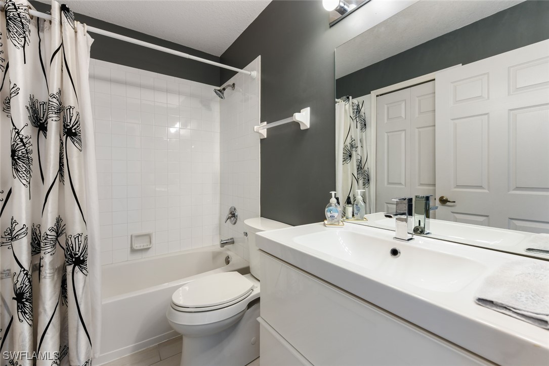 512 Islamorada Boulevard Punta Gorda, FL 33955 - Photo 25 of 46 a bathroom with a sink a toilet and a mirror