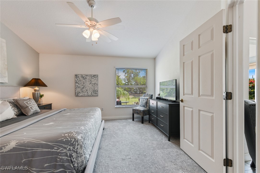 512 Islamorada Boulevard Punta Gorda, FL 33955 - Photo 34 of 46 a bedroom with a bed and a couch