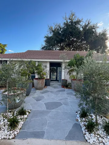 a view of a house with balcony and garden