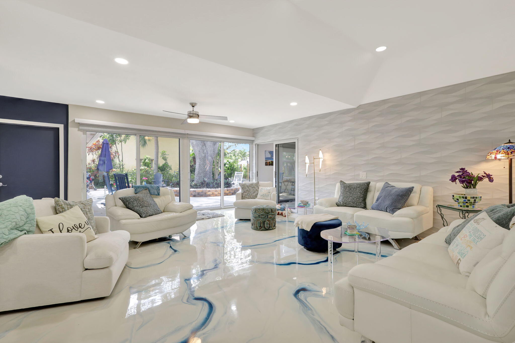 7598 West Country Club Boulevard Boca Raton, FL 33487 - Photo 17 of 103 a living room with furniture and a large window