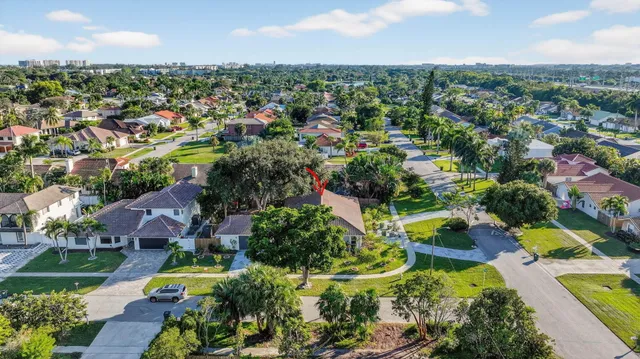 a view of a kitchen counter top a sink and appliances