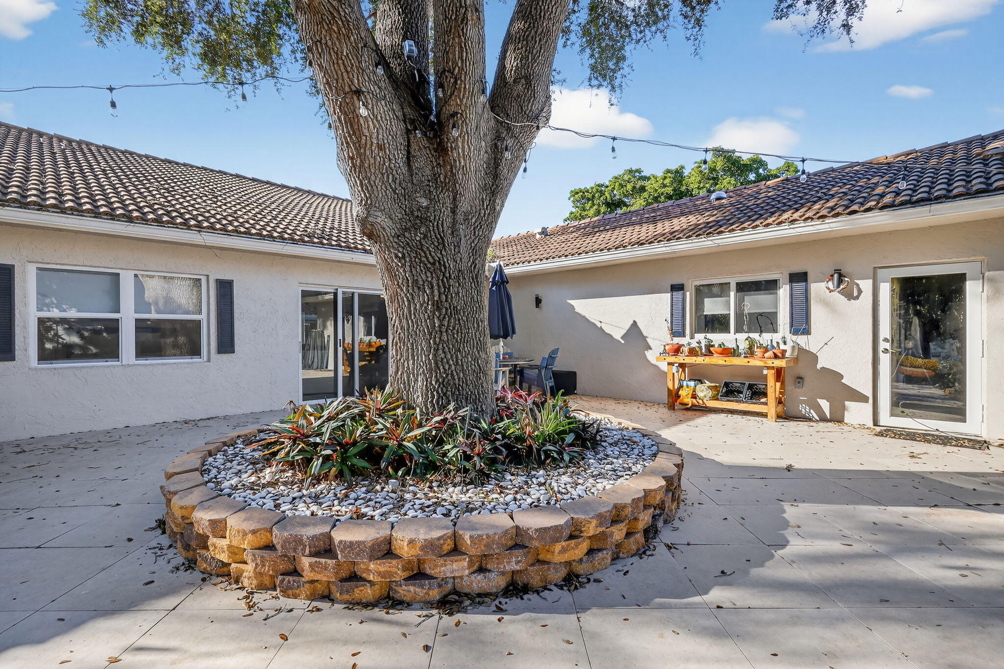 7598 West Country Club Boulevard Boca Raton, FL 33487 - Photo 26 of 103 a front view of a house with entertaining space