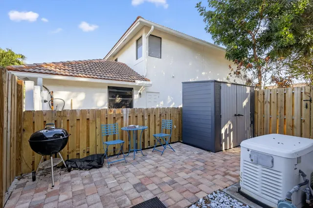 a table and chairs in front of a door
