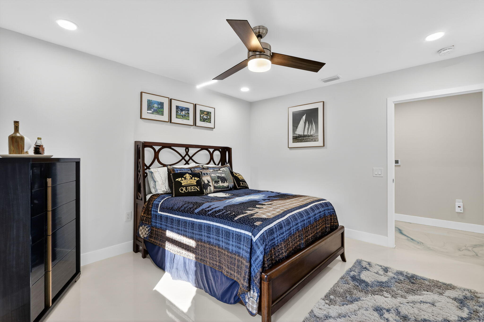 7598 West Country Club Boulevard Boca Raton, FL 33487 - Photo 81 of 103 a bedroom with a bed and wooden floor