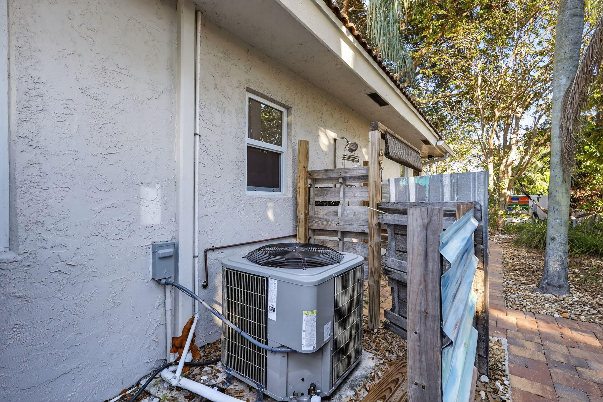 7598 West Country Club Boulevard Boca Raton, FL 33487 - Photo 94 of 103 a table and chairs in front of a door
