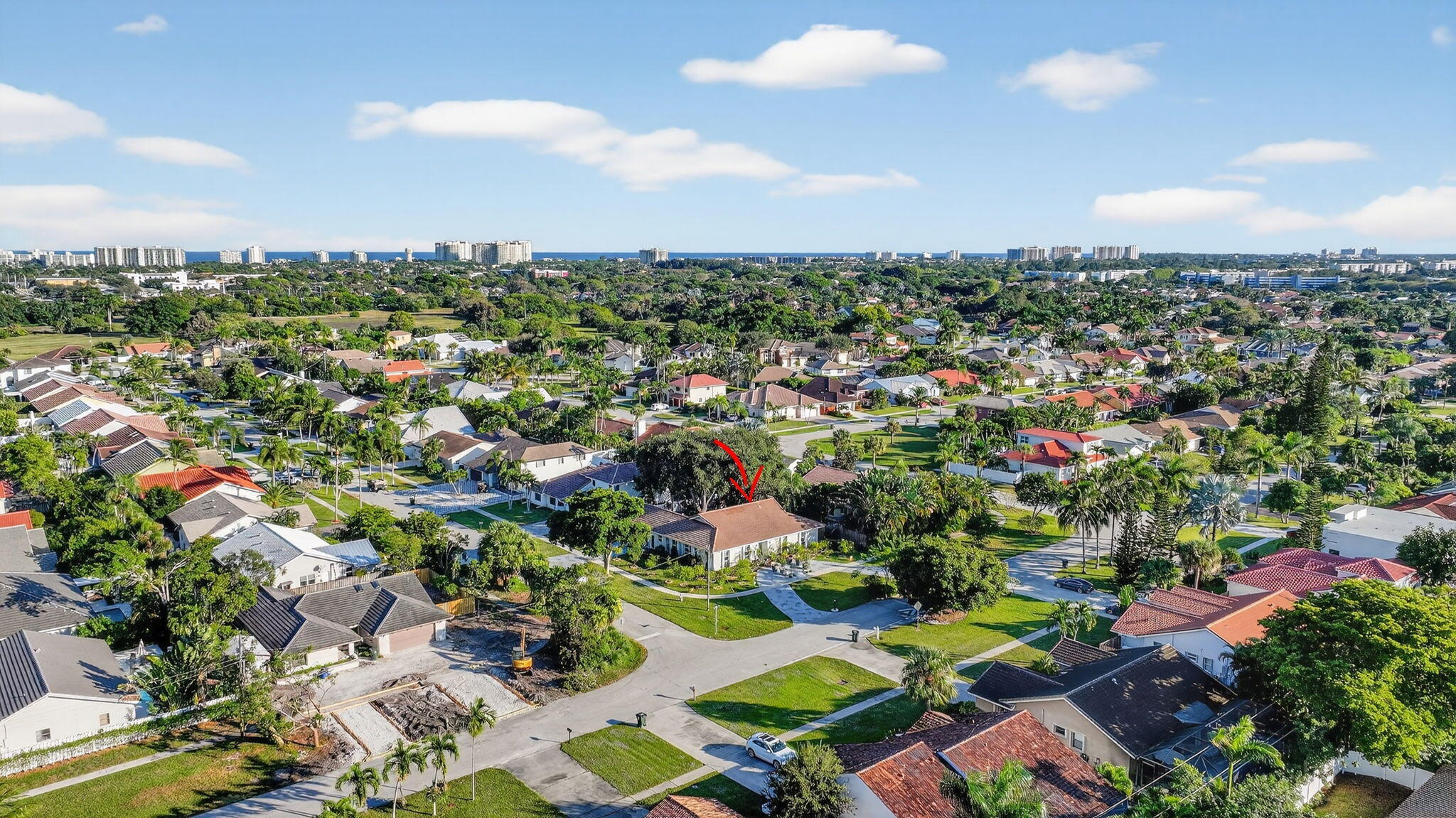 7598 West Country Club Boulevard Boca Raton, FL 33487 - Photo 96 of 103 an aerial view of residential houses with outdoor space and trees
