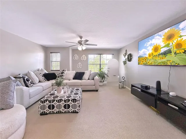 a living room with furniture and flat screen tv