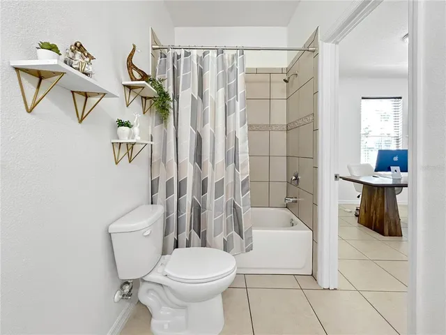a bathroom with a toilet sink and shower
