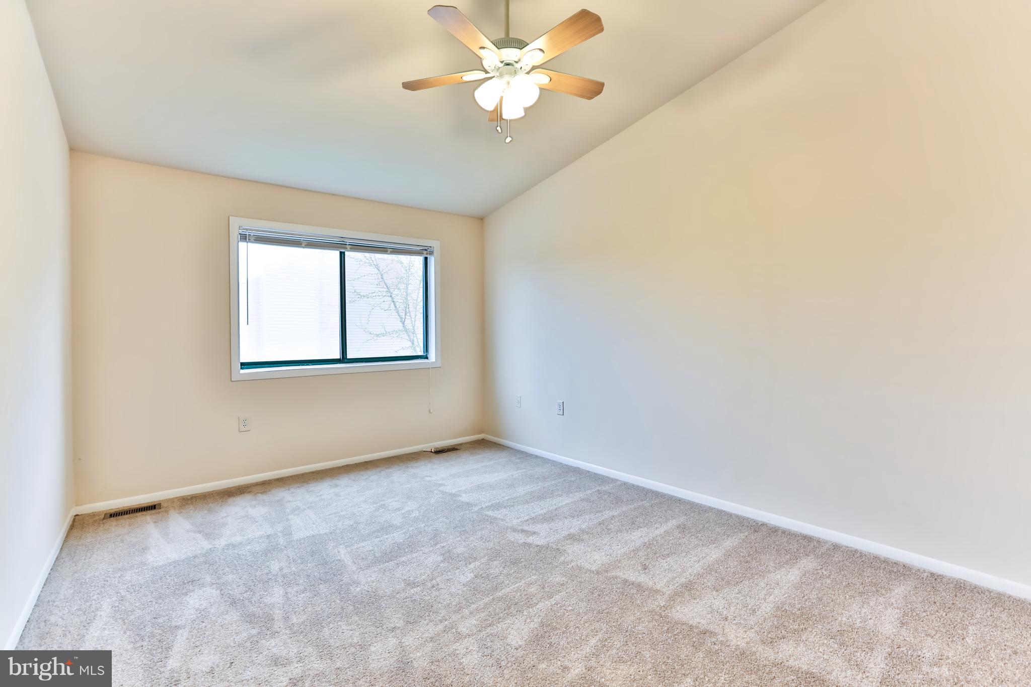 6 Winners Circle, Unit 3C Owings Mills, MD 21117 - Photo 22 of 26 an empty room with windows and fan