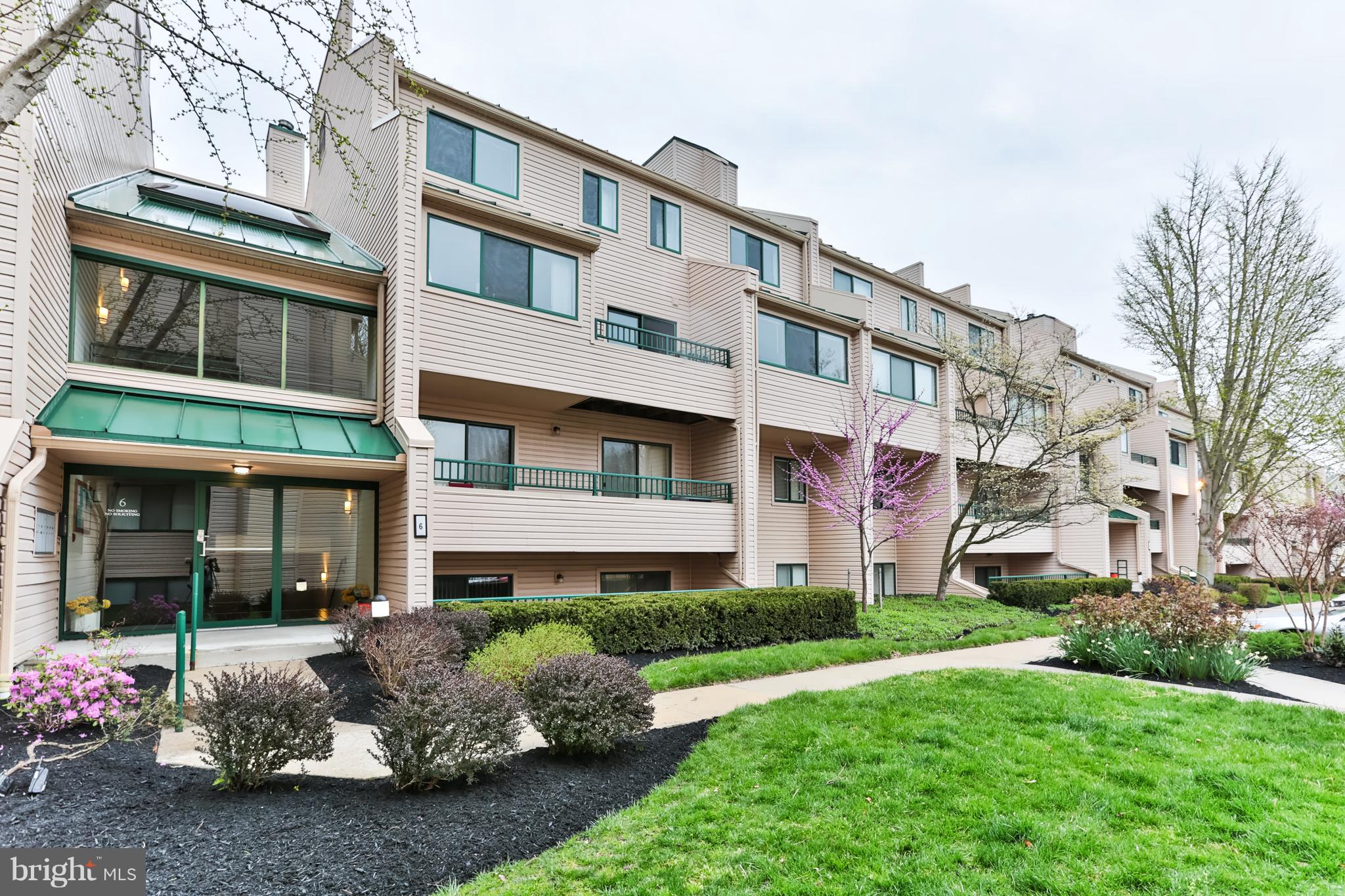 6 Winners Circle, Unit 3C Owings Mills, MD 21117 - Photo 26 of 26 a front view of a building with a garden