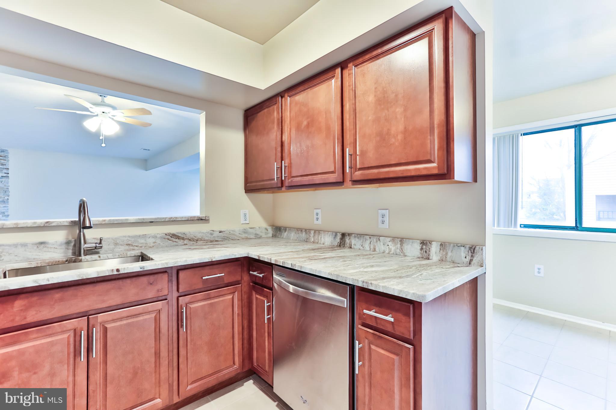 6 Winners Circle, Unit 3C Owings Mills, MD 21117 - Photo 4 of 26 a kitchen with a sink and a window