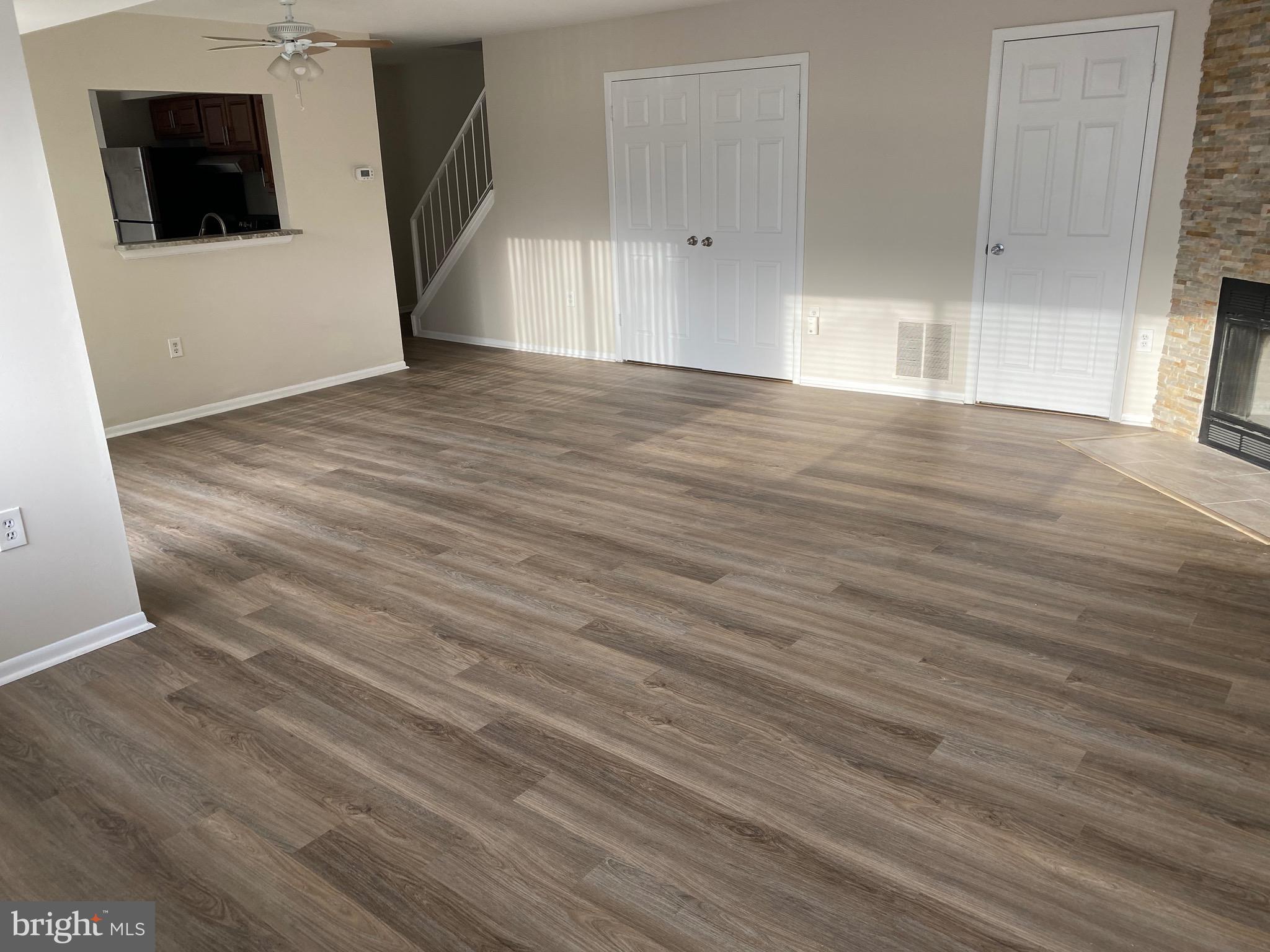 6 Winners Circle, Unit 3C Owings Mills, MD 21117 - Photo 9 of 26 a view of a big room with wooden floor and windows
