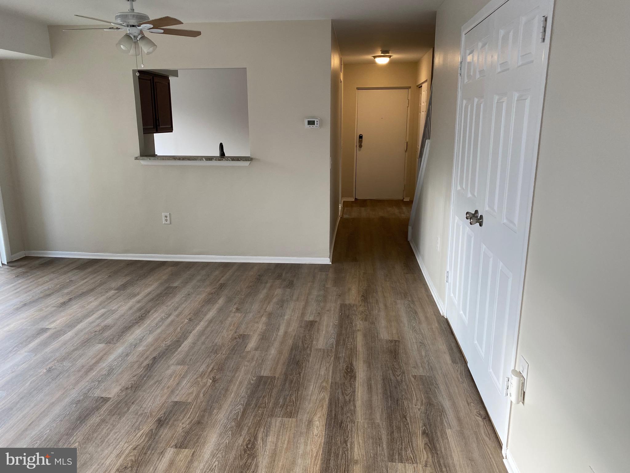6 Winners Circle, Unit 3C Owings Mills, MD 21117 - Photo 10 of 26 a view of a hallway with wooden floor