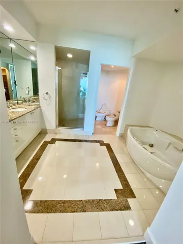a view hallway with wooden floor and a rug