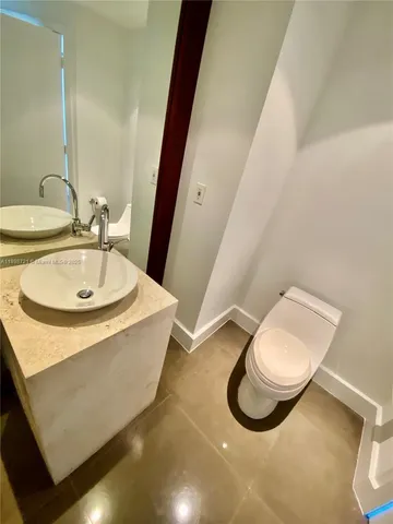 a view of an empty room with a bathroom