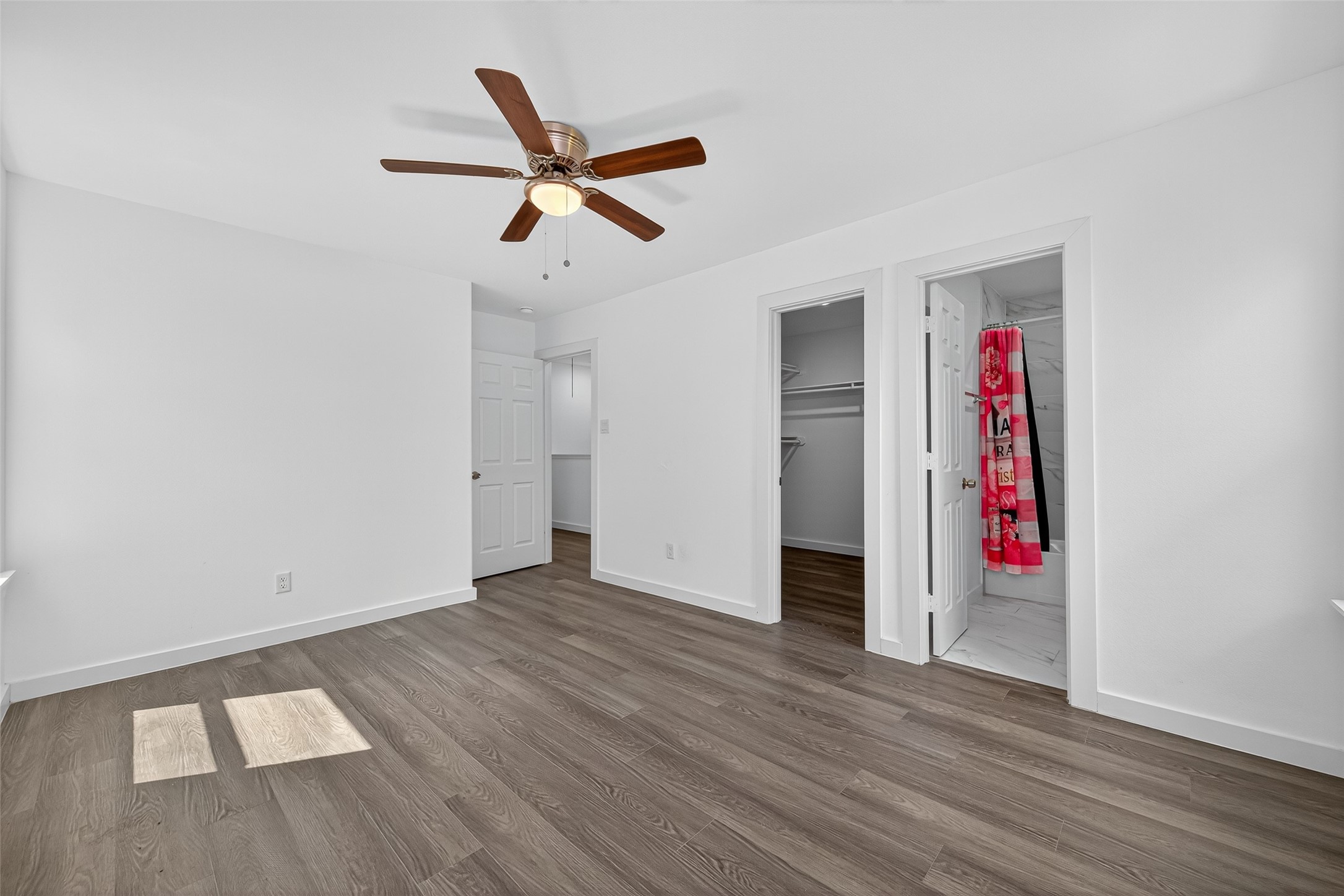 9405 Madera Road Houston, TX 77078 - Photo 21 of 32 an empty room with wooden floor and entryway