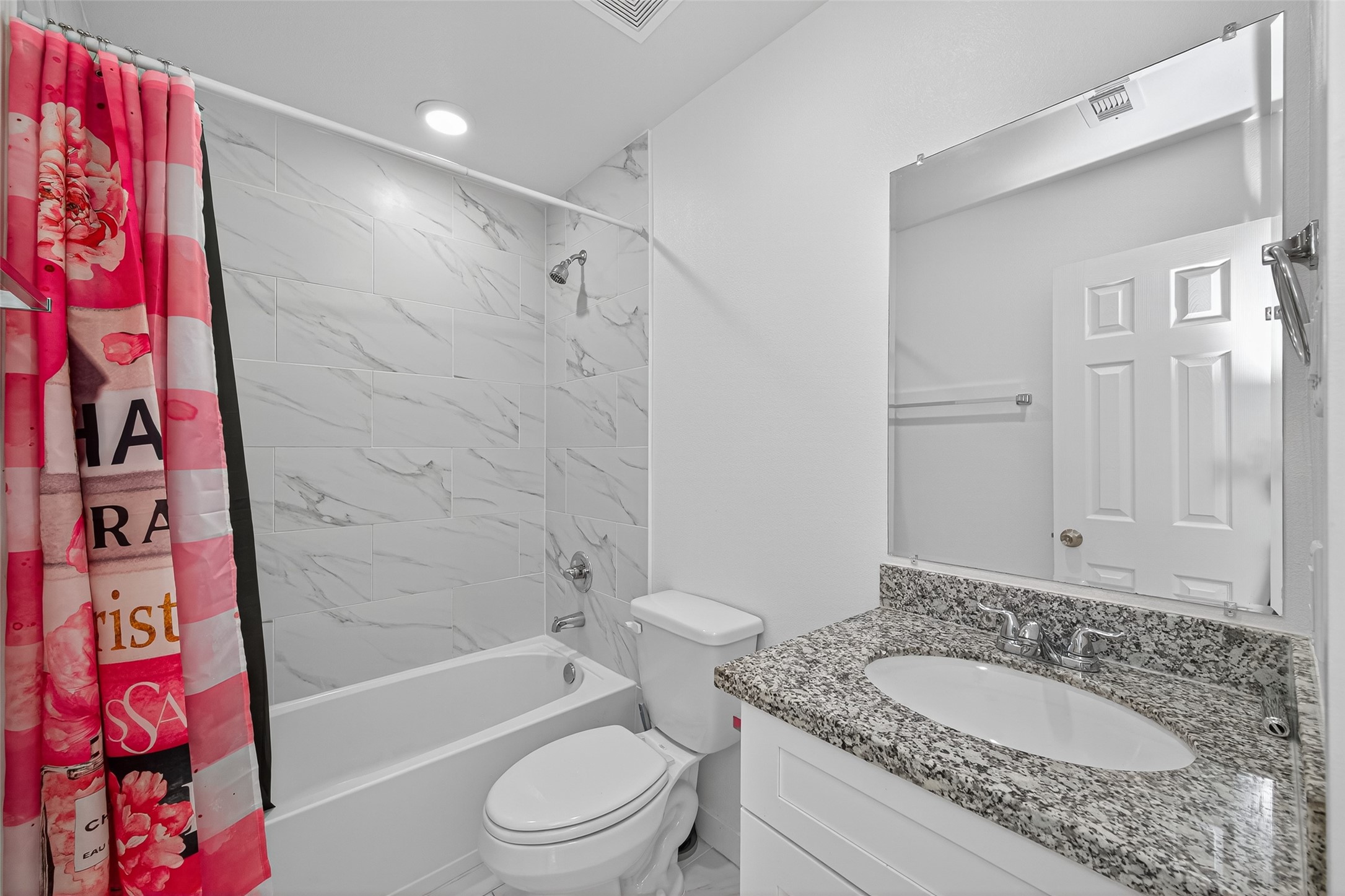 9405 Madera Road Houston, TX 77078 - Photo 22 of 32 a bathroom with a granite countertop sink and a mirror
