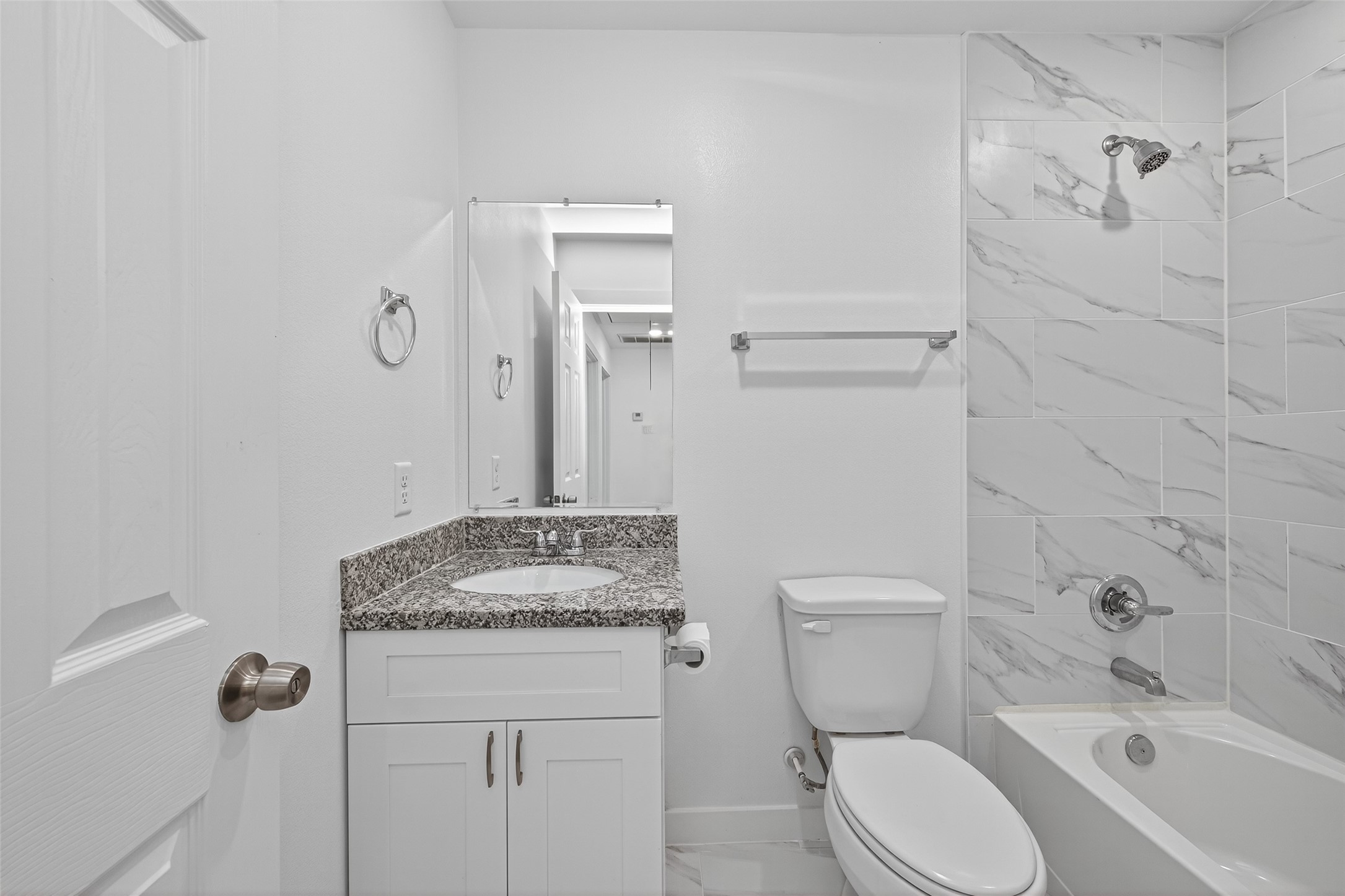 9405 Madera Road Houston, TX 77078 - Photo 28 of 32 a bathroom with a granite countertop sink toilet and shower