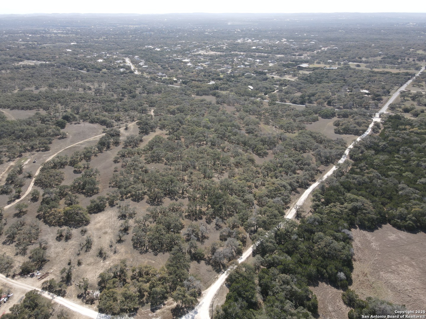 346 Ammann Road Boerne, TX 78015 - Photo 5 of 6 an aerial view of house with yard and mountain view in back