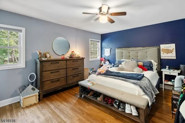 a bed room with bed and a window