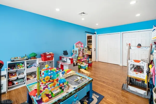 a room with toys and wooden floor