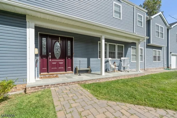 a front view of a house with having patio