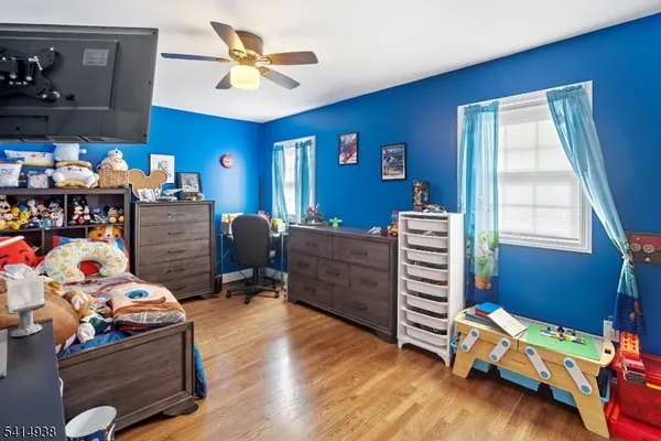 a bathroom with a double vanity sink a mirror and a shower