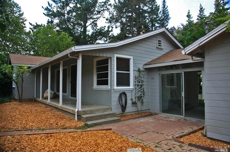 7314 Lynch Road Sebastopol, CA 95472 - Photo 1 of 1 a view of a house with a small yard plants and large tree