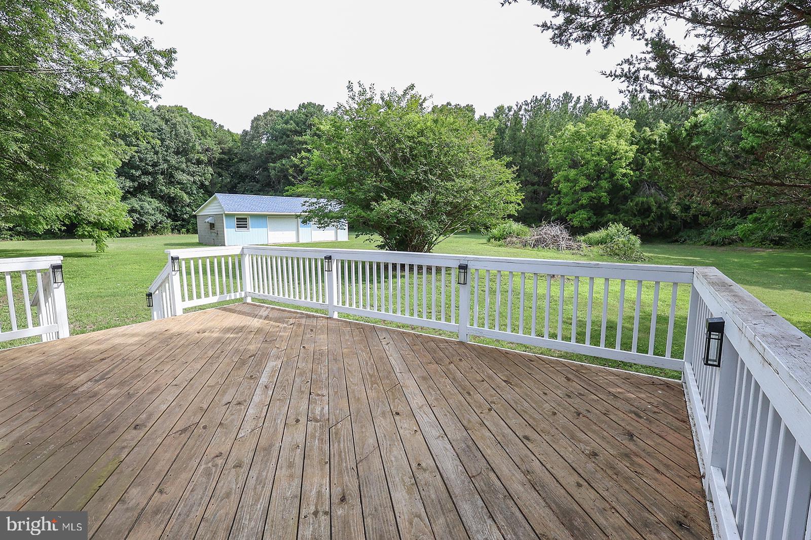 48146 Mallard View Lane St. Inigoes, MD 20684 - Photo 36 of 46 Spacious deck overlooking lush greenery.