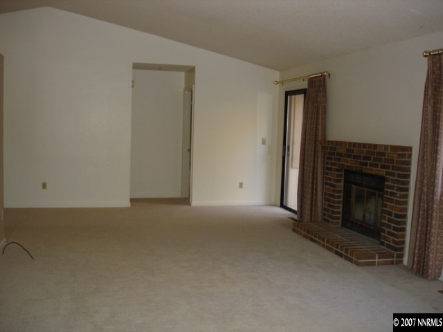 265 Cliff View Court Reno, NV 89523 - Photo 3 of 6 an empty room with a fireplace