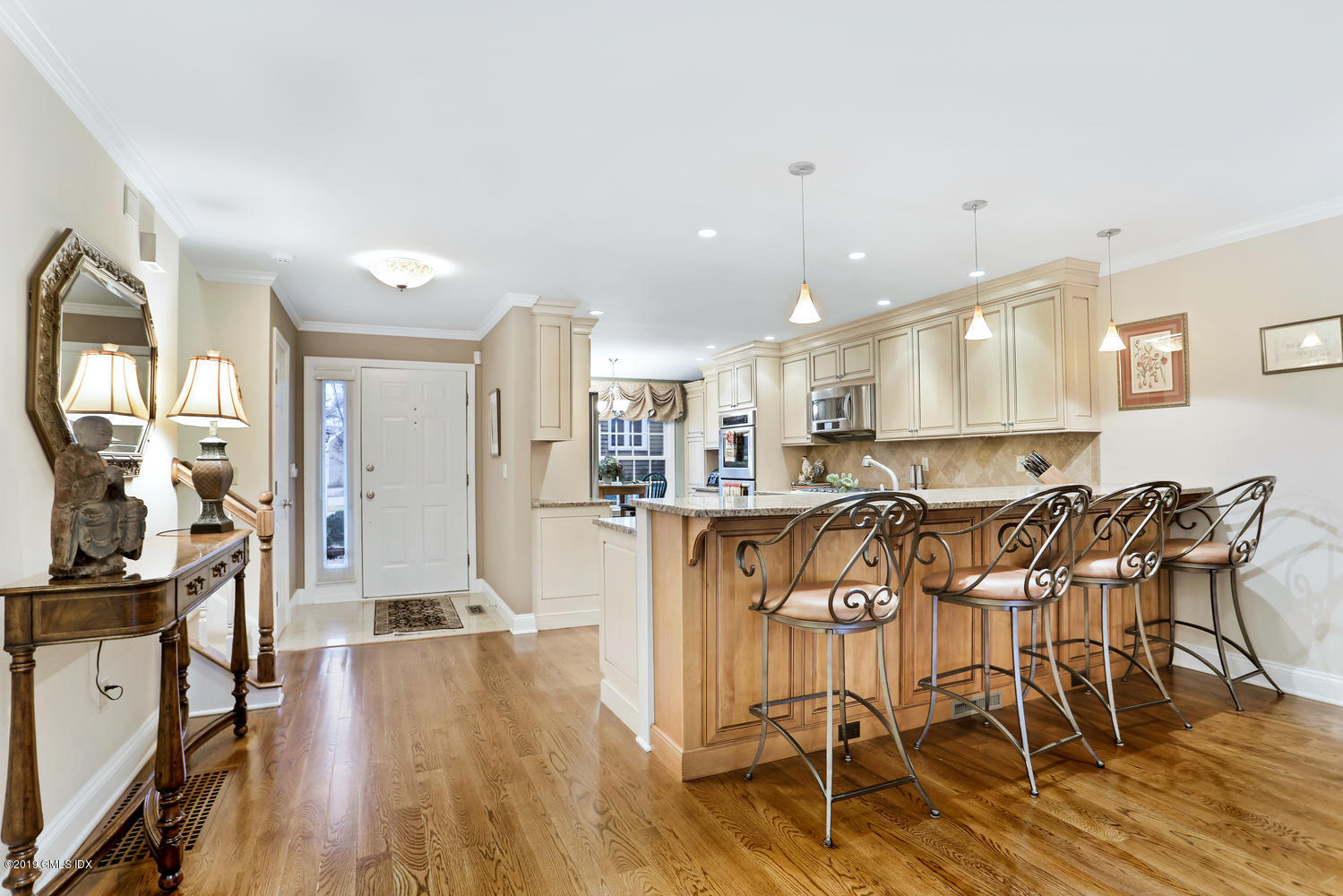 193 Hamilton Avenue, Unit 10 Greenwich, CT 06830 - Photo 11 of 22 a view of a dining room with furniture and wooden floor