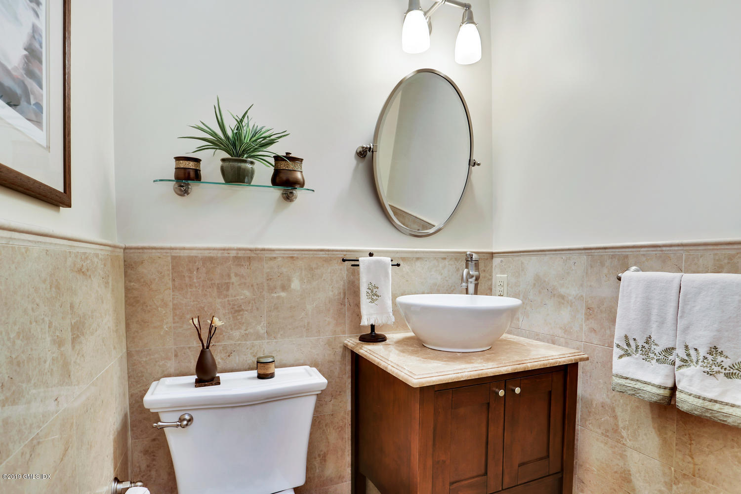 193 Hamilton Avenue, Unit 10 Greenwich, CT 06830 - Photo 12 of 22 a bathroom with a sink and a mirror