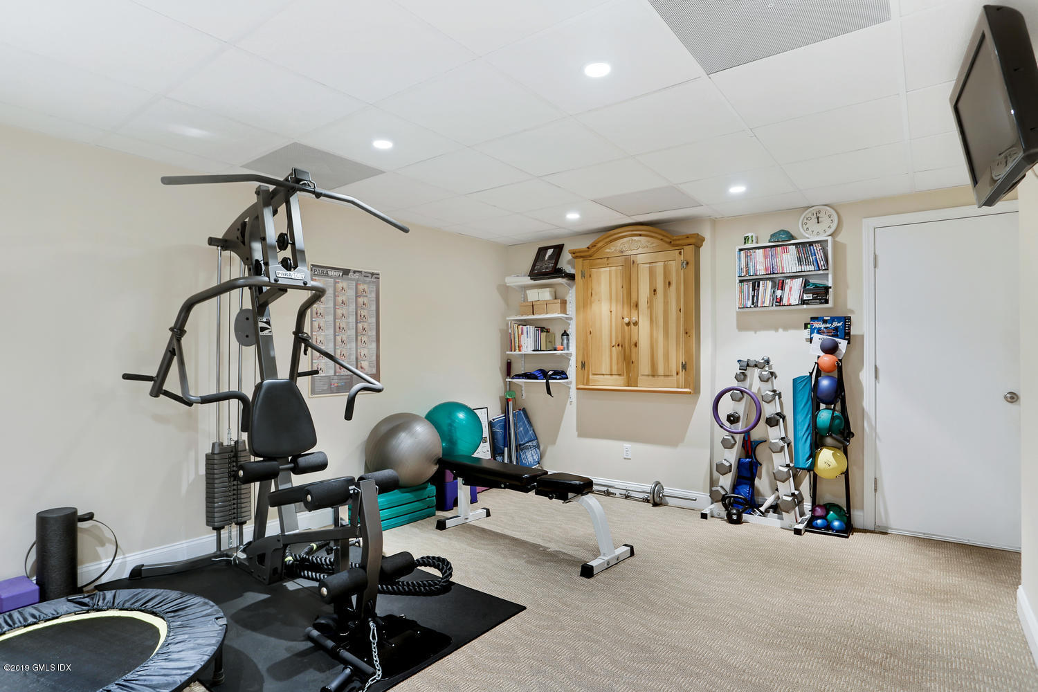 193 Hamilton Avenue, Unit 10 Greenwich, CT 06830 - Photo 17 of 22 a view of a room with gym equipment