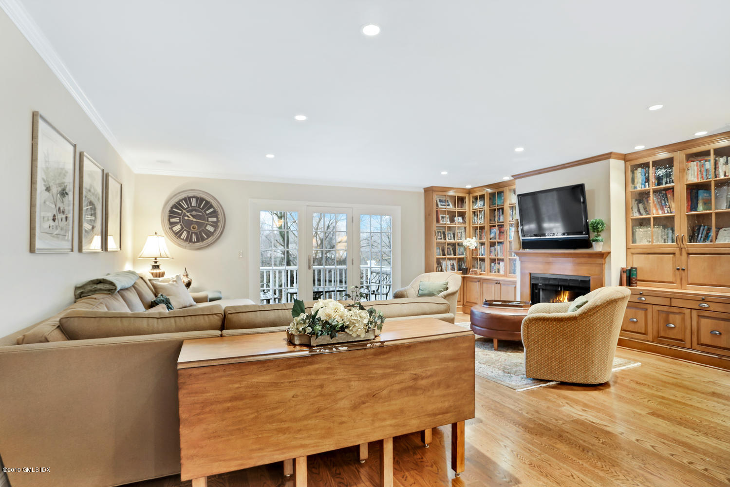 193 Hamilton Avenue, Unit 10 Greenwich, CT 06830 - Photo 6 of 22 a living room with fireplace furniture and a flat screen tv
