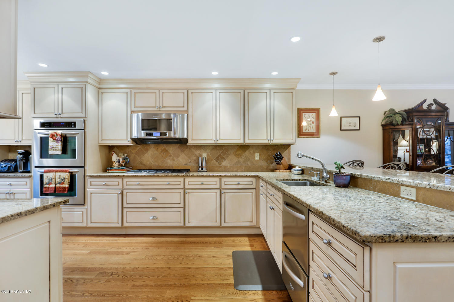 193 Hamilton Avenue, Unit 10 Greenwich, CT 06830 - Photo 7 of 22 a kitchen with stainless steel appliances granite countertop a sink stove and cabinets