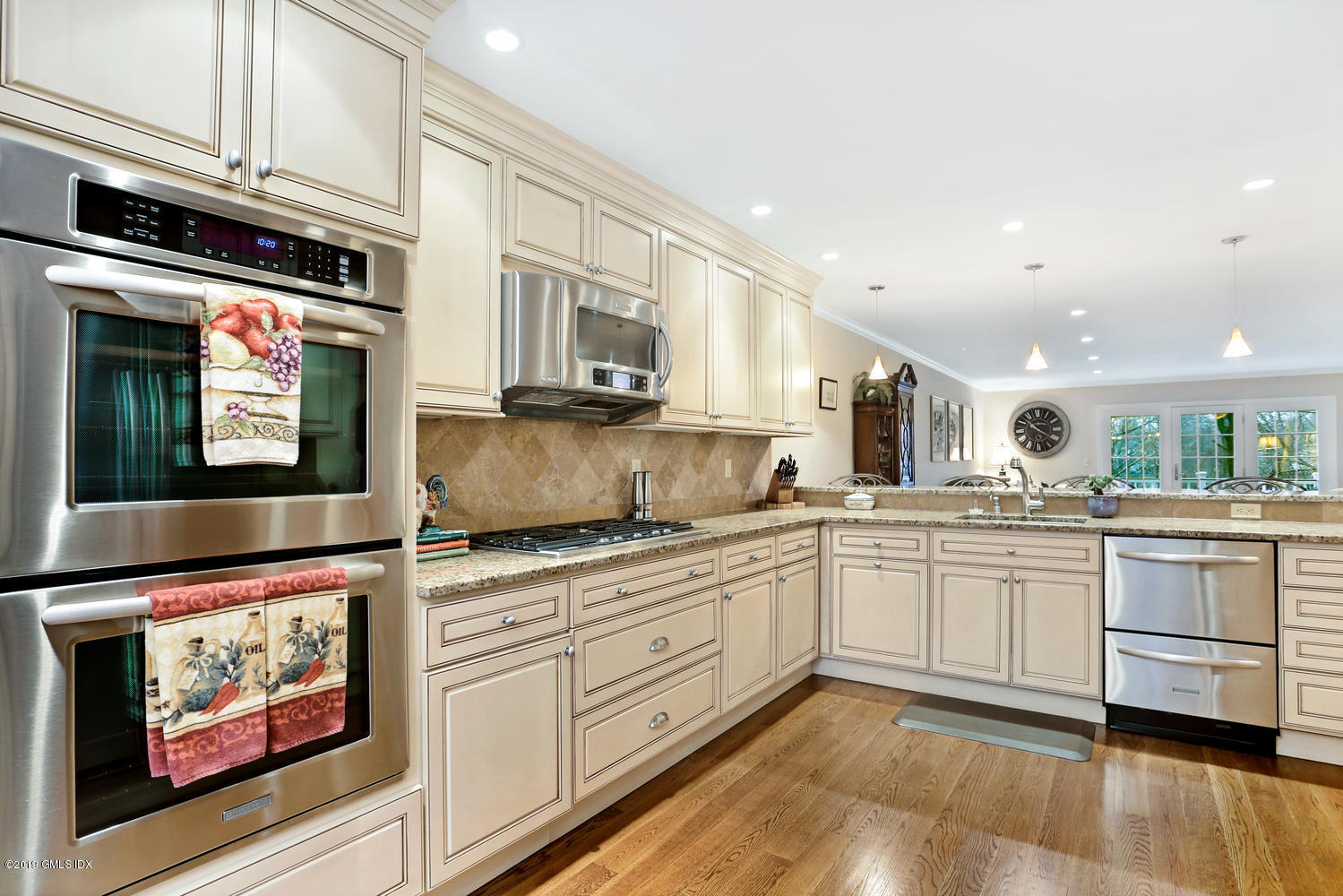 193 Hamilton Avenue, Unit 10 Greenwich, CT 06830 - Photo 9 of 22 a kitchen with stainless steel appliances granite countertop a stove and white cabinets
