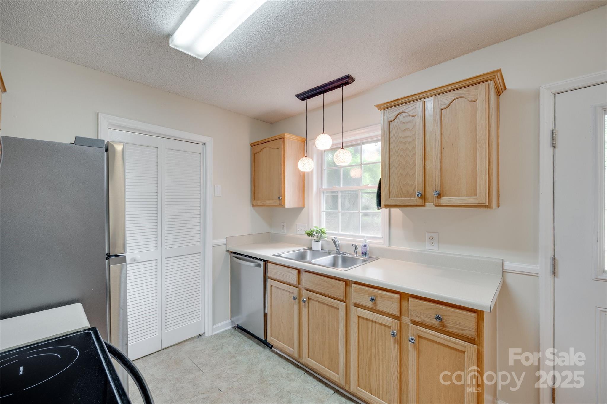 110 8th Street York, SC 29745 - Photo 11 of 26 a kitchen with a sink appliances and cabinets