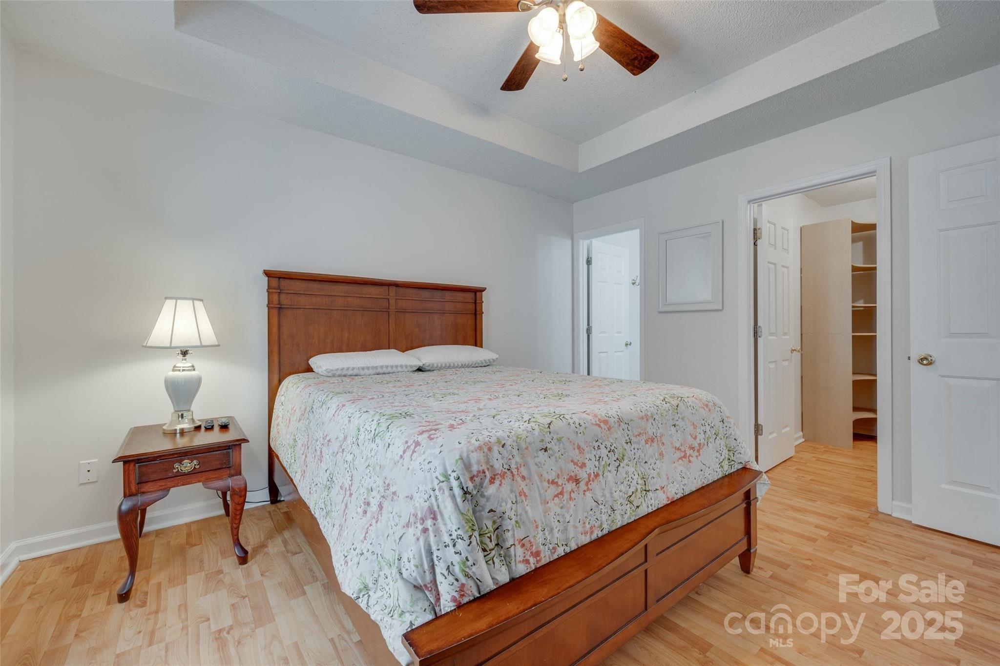 110 8th Street York, SC 29745 - Photo 13 of 26 a bedroom with a bed and a chandelier