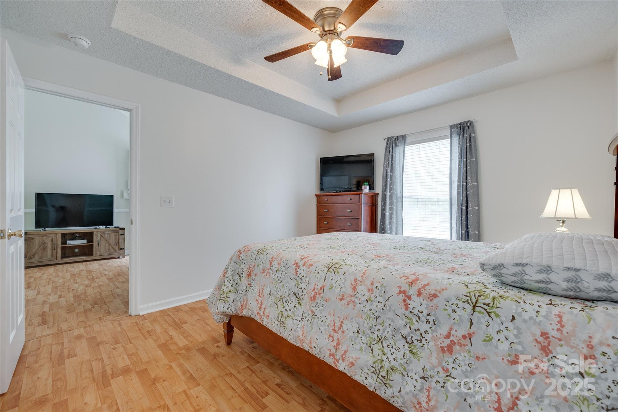 110 8th Street York, SC 29745 - Photo 14 of 26 a bedroom with a bed and a flat screen tv