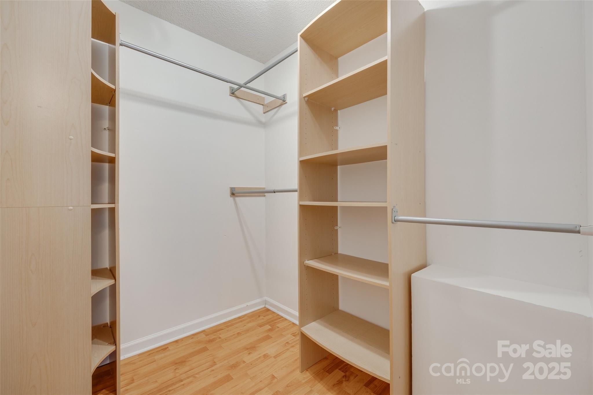 110 8th Street York, SC 29745 - Photo 16 of 26 a view of walk in closet with empty racks