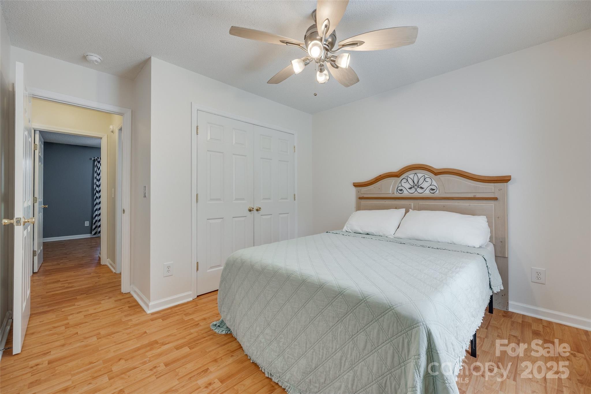 110 8th Street York, SC 29745 - Photo 17 of 26 a bedroom with a bed and a chandelier