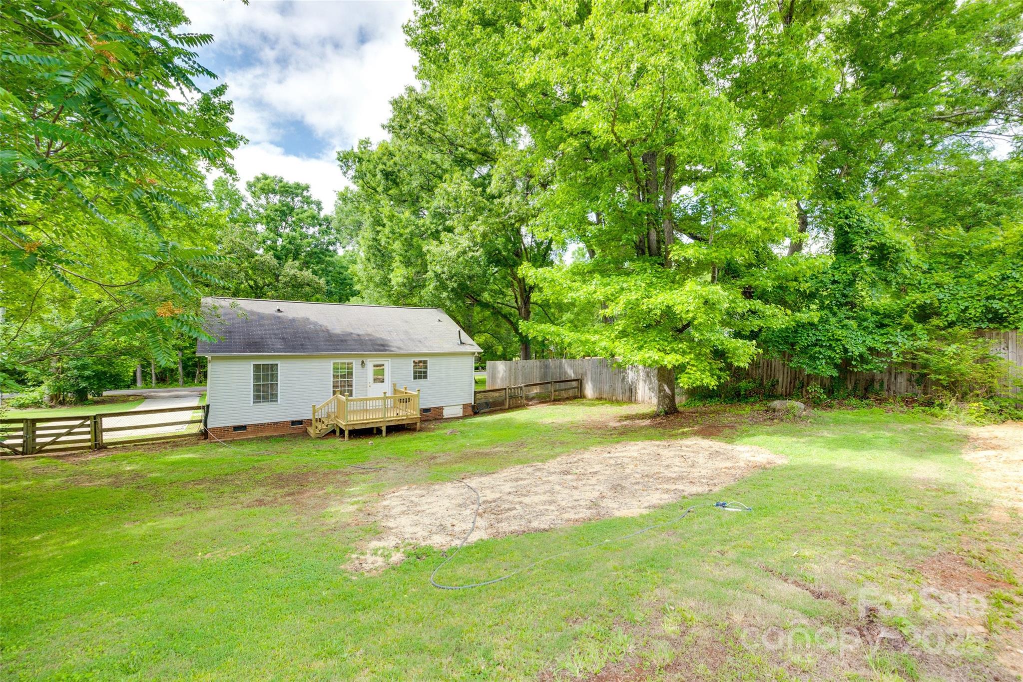 110 8th Street York, SC 29745 - Photo 23 of 26 a view of a house with a big yard plants and large trees
