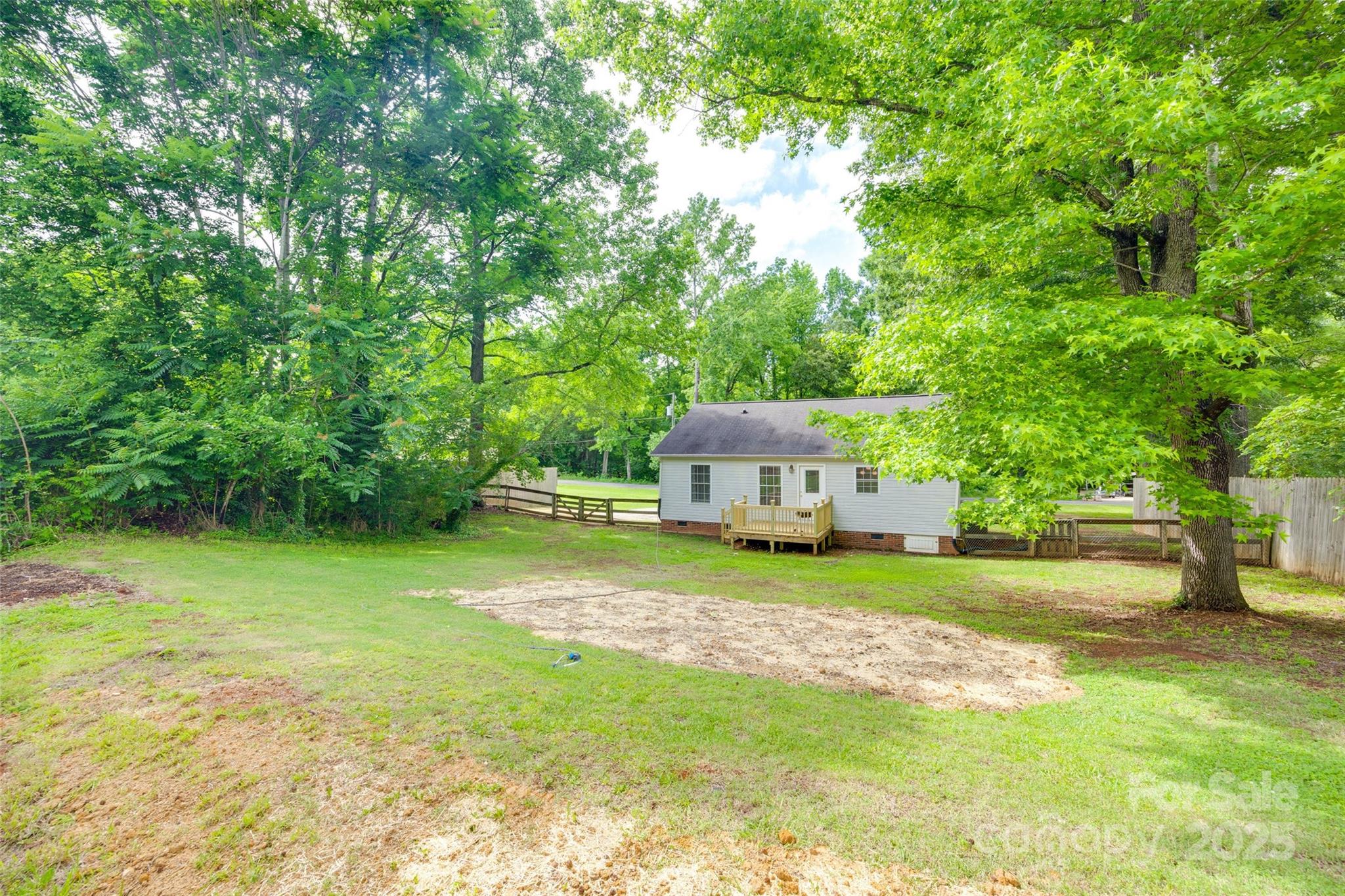 110 8th Street York, SC 29745 - Photo 24 of 26 a front view of a house with a garden