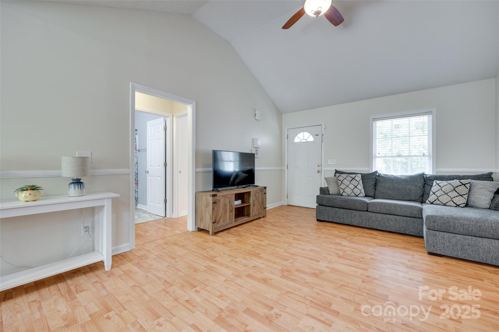 110 8th Street York, SC 29745 - Photo 4 of 26 a living room with furniture and a flat screen tv