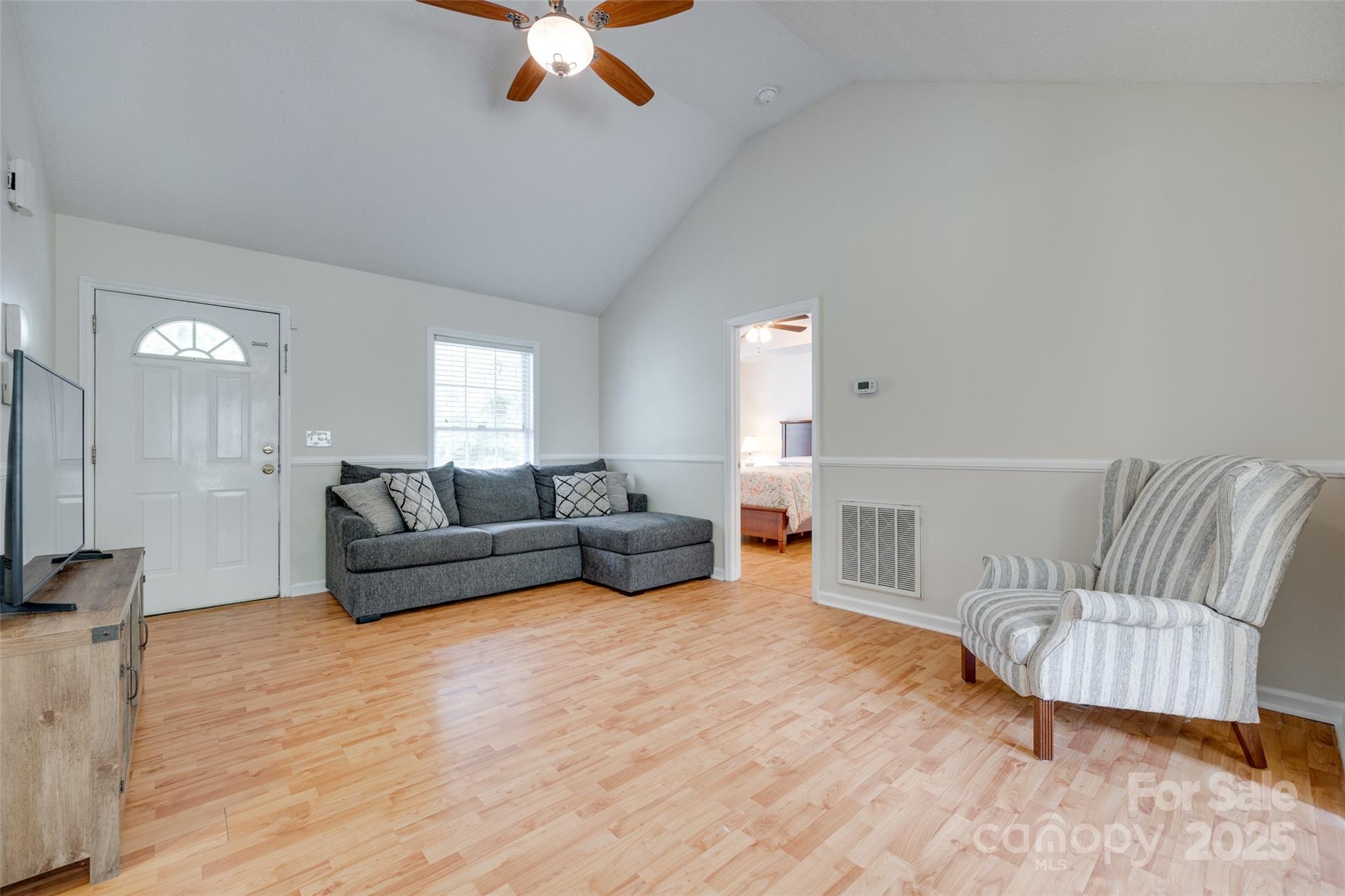 110 8th Street York, SC 29745 - Photo 5 of 26 a living room with furniture and a wooden floor
