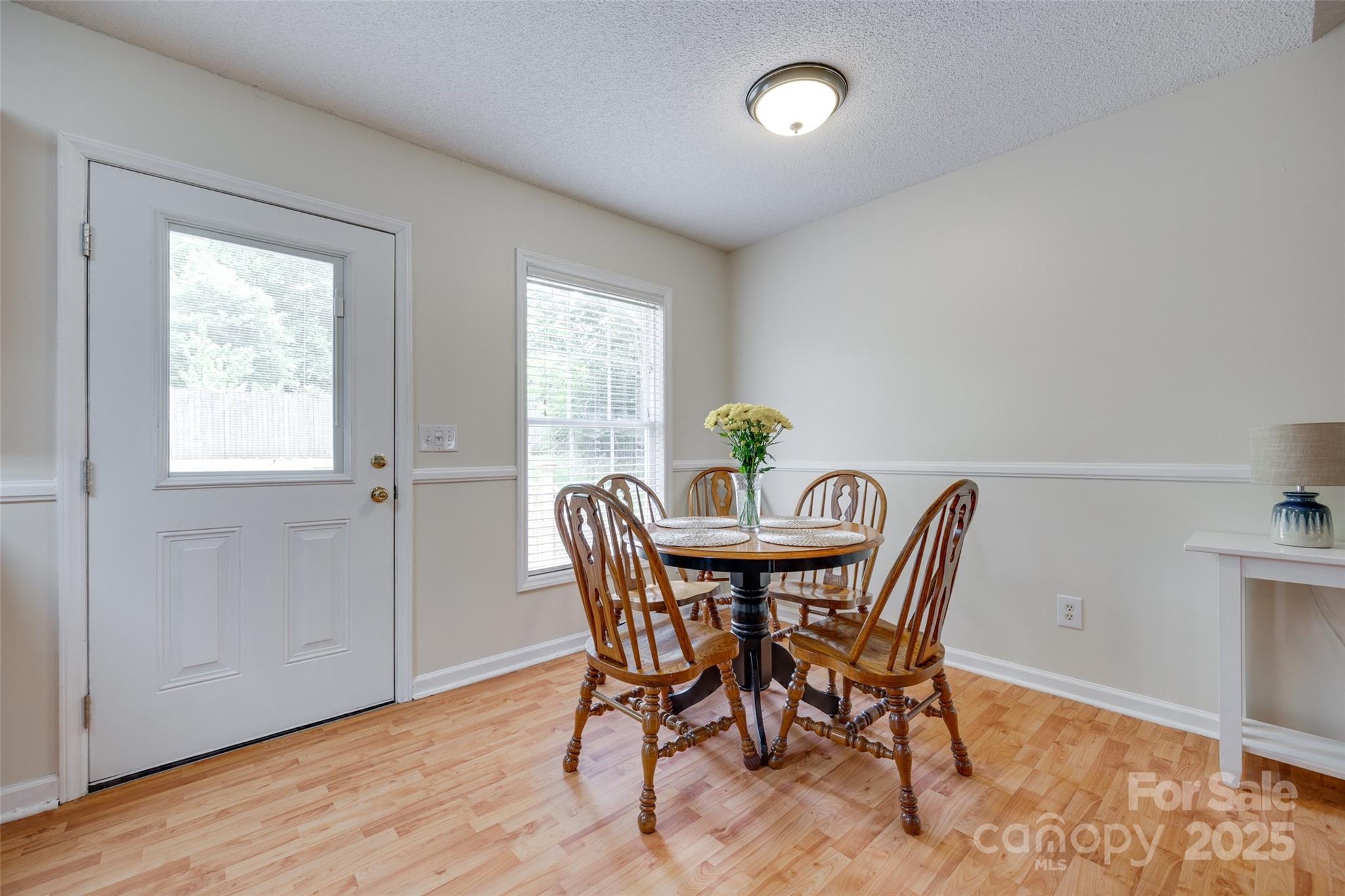 110 8th Street York, SC 29745 - Photo 7 of 26 a view of a dining room with furniture and wooden floor