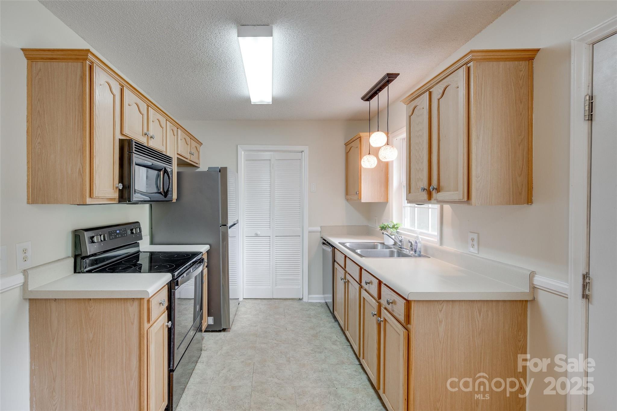 110 8th Street York, SC 29745 - Photo 9 of 26 a kitchen with a sink stove top oven and microwave