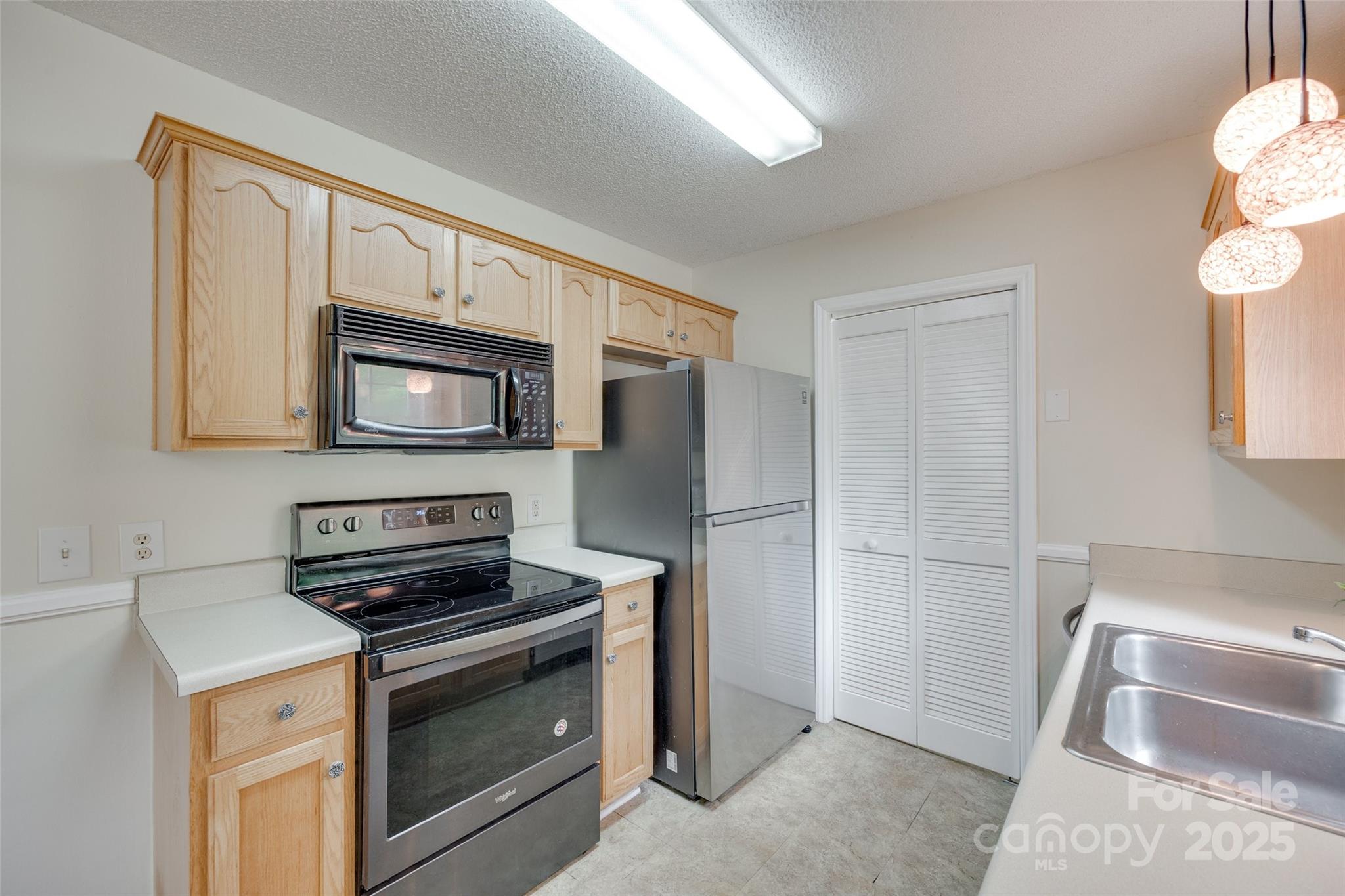 110 8th Street York, SC 29745 - Photo 10 of 26 a kitchen with a refrigerator stove and microwave
