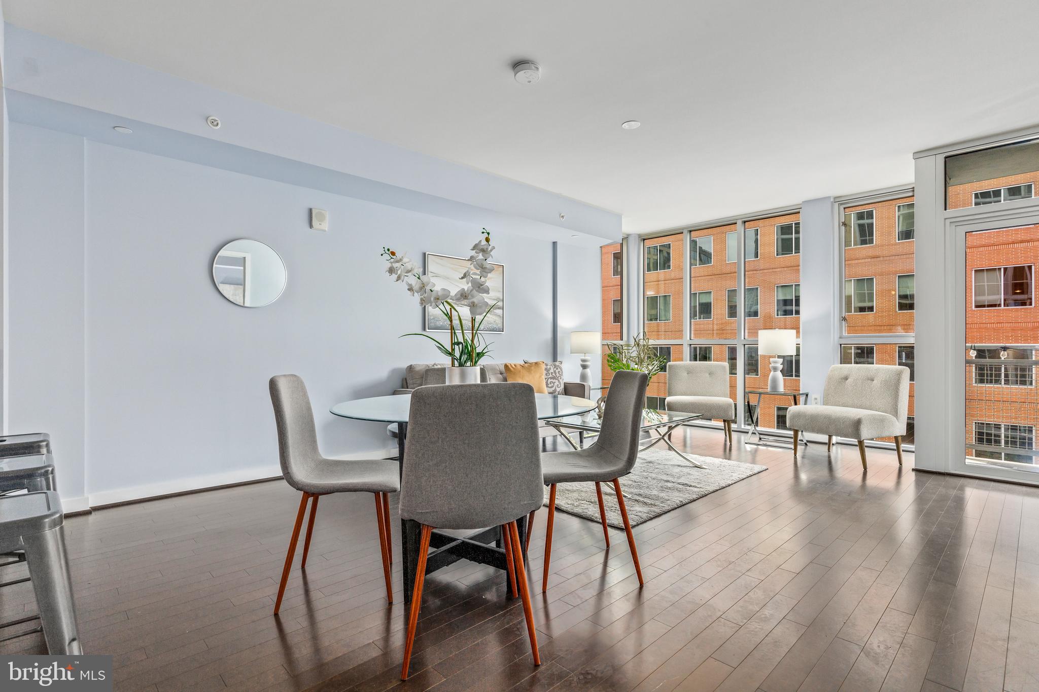 1025 First Street Southeast, Unit 611 Washington, DC 20003 - Photo 15 of 32 a view of a dining room with furniture and wooden floor
