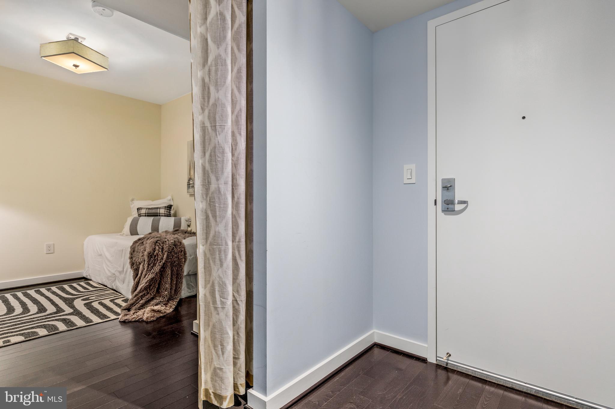 1025 First Street Southeast, Unit 611 Washington, DC 20003 - Photo 2 of 32 a room that has a couch and a chair